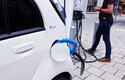 electric-car-charging-station-electric-cable-recharge-terminal-man.jpg