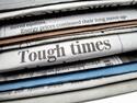newspaper with tough times hedXSmall.jpg